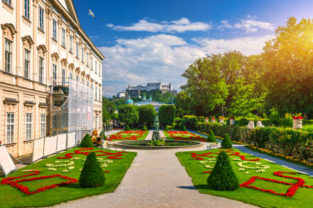 Beautiful view of famous Mirabell Gardens with the old historic Fortress Hohensalzburg in the background in Salzburg, Austria. Famous Mirabell Gardens with historic Fortress in Salzburg, Austria.のeditorial素材