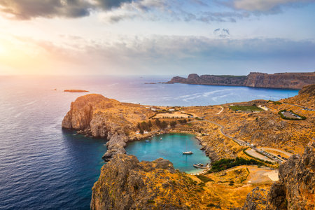 Aerial view on St. Paul's bay in Lindos, Rhodes island, Greece. Panoramic shot overlooking St Pauls Bay at Lindos on the Island of Rhodes, Greece, Europe.の写真素材