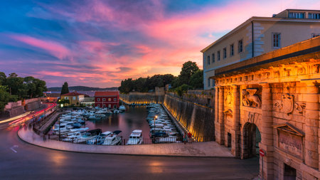 The Land Gate in Zadar at sunset, the main entrance into the city, built by a Venetian architect Michele Sanmicheli in 1543, Zadar, Croatia. The Land Gate to the Old City of Zadar, Croatia.の写真素材