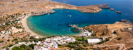 Lindos small whitewashed village and the Acropolis, scenery of Rhodos Island at Aegean Sea, Rhodes, Greece. Lindos bay, village and Acropolis, Rhodes, Greeceの写真素材