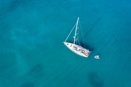 Yacht on lagoon at sunny day. Sailing boat. Yacht in the sea, aerial photography drone. Amazing...