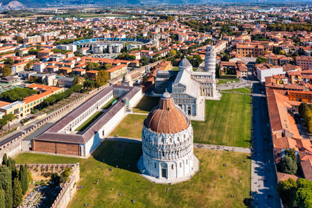 Pisa Cathedral and the Leaning Tower in a sunny day in Pisa, Italy. Pisa Cathedral with Leaning Tower of Pisa on Piazza dei Miracoli in Pisa, Tuscany, Italy.の写真素材