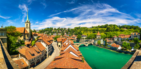 View of the Bern old city center and Nydeggbrucke bridge over river Aare, Bern, Switzerland. Bern...