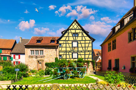 Traditional timbered house in Turckheim, Alsace, France. One of the famous cities in Alsace scenic route near Colmar, France. Colorful traditional french houses in Turckheim town of Alsace, France.のeditorial素材
