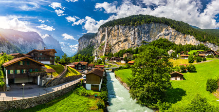 Amazing summer landscape of touristic alpine village Lauterbrunnen with famous church and Staubbach waterfall. Location: Lauterbrunnen village, Berner Oberland, Switzerland, Europe.のeditorial素材
