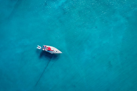 Yacht on lagoon at sunny day. Sailing boat. Yacht in the sea, aerial photography drone. Amazing...
