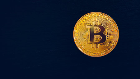 Crypto currency golden coin with bitcoin symbol on isolated on black background. Bitcoin Coin on black background. Bitcoin cryptocurrency.  Cryptocurrency Coin Concept.の写真素材