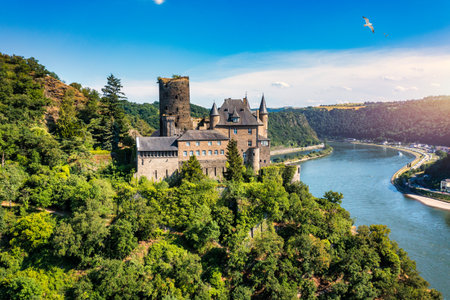 Katz castle and romantic Rhine in summer at sunset, Germany. Katz Castle or Burg Katz is a castle...