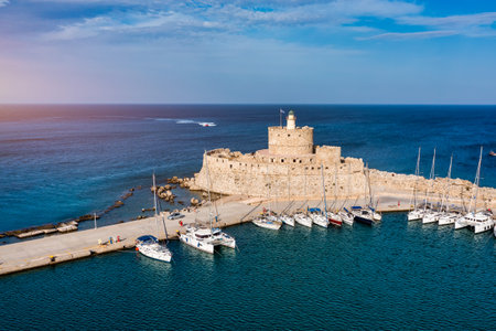 Mandraki port with deers statue, where The Colossus was standing and fort of St. Nicholas. Rhodes,...