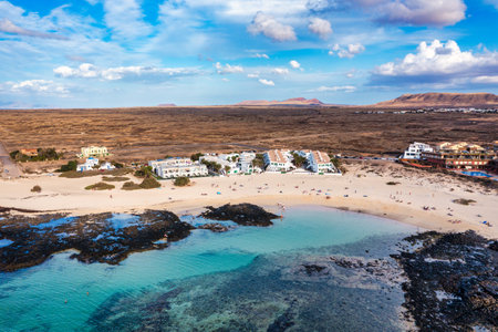 View of the beautiful Playa Chica Beach, El Cotillo, Fuerteventura, Canary Islands, Spain. White...