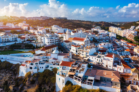 Aerial view of seaside Albufeira with wide beach and white architecture, Algarve, Portugal. Wide sandy beach in city of Albufeira, Algarve, Portugal. Aerial view of Albufeira town, Algarve, Portugal.の写真素材