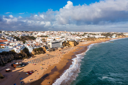 Aerial view of seaside Albufeira with wide beach and white architecture, Algarve, Portugal. Wide sandy beach in city of Albufeira, Algarve, Portugal. Aerial view of Albufeira town, Algarve, Portugal.の写真素材