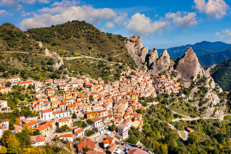 The picturesque village of Castelmezzano, province of Potenza, Basilicata, Italy. Cityscape aerial view of medieval city of Castelmazzano, Italy. Castelmezzano village in Apennines Dolomiti Lucane.の写真素材