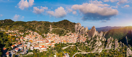 The picturesque village of Castelmezzano, province of Potenza, Basilicata, Italy. Cityscape aerial view of medieval city of Castelmazzano, Italy. Castelmezzano village in Apennines Dolomiti Lucane.の写真素材
