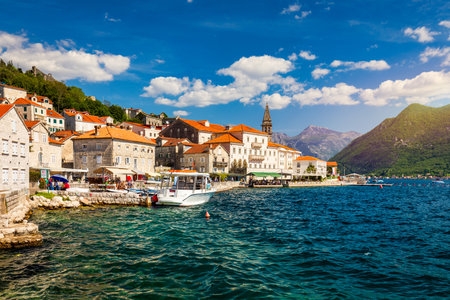 View of the historic town of Perast at famous Bay of Kotor on a beautiful sunny day with blue sky...