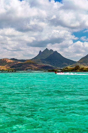Beautiful catamaran in the paradise turquoise lagoon of the east coast of Mauritius. View of the lagoon of Mauritius in the Indian Ocean.の写真素材