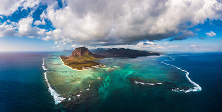 Aerial view of Mauritius island panorama and famous Le Morne Brabant mountain, beautiful blue lagoon...