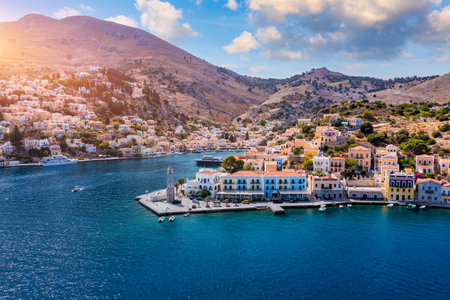Aerial view of the beautiful greek island of Symi (Simi) with colourful houses and small boats....