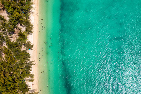 Mauritius beach aerial view of Mont Choisy beach in Grand Baie, Pereybere North. Mont Choisy, public beach in Mauritius island, Africa. Beautiful beach of Mont Choisy in Mauritius, drone aerial view.の写真素材
