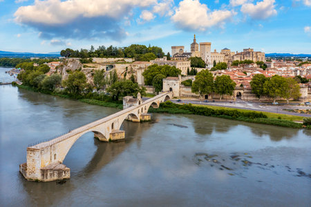 Beautiful view of Avignon with famous bridge Saint-Benezet, medieval architecture along the Rhone River in Avignon, France. The Pont Saint Benezet and the Papal palace in Avignon, South France.の写真素材