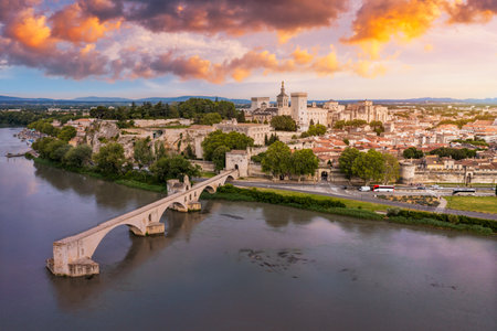 Beautiful view of Avignon with famous bridge Saint-Benezet, medieval architecture along the Rhone River in Avignon, France. The Pont Saint Benezet and the Papal palace in Avignon, South France.の写真素材