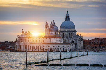 Sunset in Venice. Image of Grand Canal in Venice, with Santa Maria della Salute Basilica in the background. Venice is a popular tourist destination of Europe. Venice, Italy.の写真素材