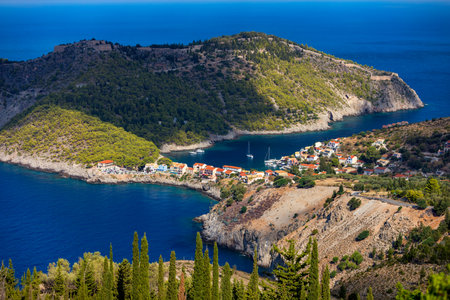 Assos village in Kefalonia, Greece. Turquoise colored bay in Mediterranean sea with beautiful colorful houses in Assos village in Kefalonia, Greece, Ionian island, Cephalonia, Assos village.の写真素材