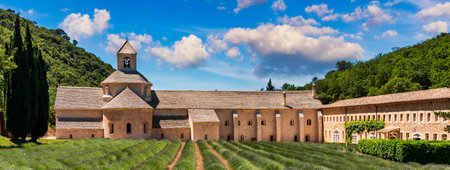 Romanesque Cistercian Abbey of Notre Dame of Senanque set amongst flowering lavender fields, near Gordes, Provence, France. Abbaye Notre-Dame de Senanque Romanesque Cistercian Abbey, Provence, France.の写真素材