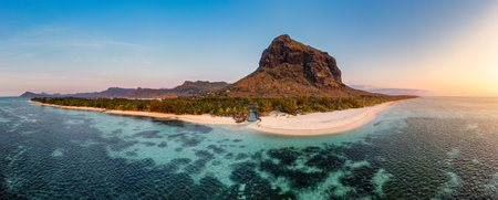 Aerial view of Le morne Brabant in Mauriutius. Tropical crystal ocean with Le Morne mountain and luxury beach in Mauritius. Le Morne beach with palm trees, white sand and luxury resorts, Mauritius.の写真素材
