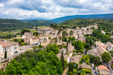Menerbes village in Provence on a summer day, France, Luberon, Vaucluse. Village of Menerbes, the village and the Luberon mountains also called the most beautiful village of Luberon, France, Provence.の写真素材