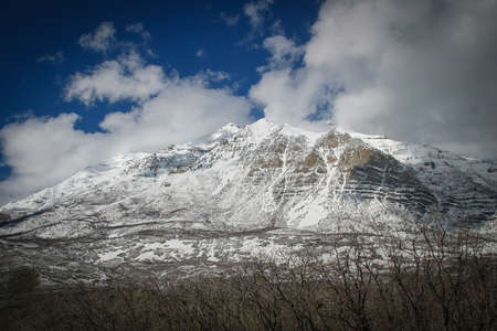 A rock mountain covered by snowの写真素材