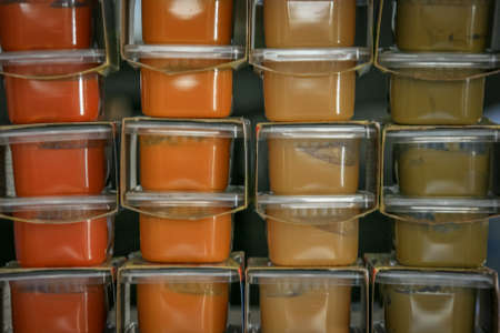 Stacks of different flavored baby foodの写真素材
