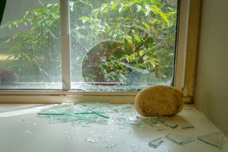 A rock thrown through a windowの写真素材