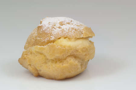single cream puff with sugar and white background - DSC0755の写真素材