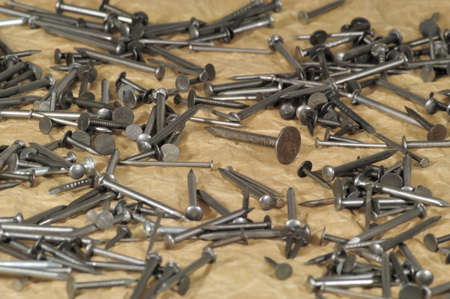 various size iron nails on the brown paper background - DSC0950の写真素材