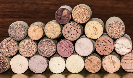 Several corks of wine bottles arranged in transverse position, front focus.の写真素材