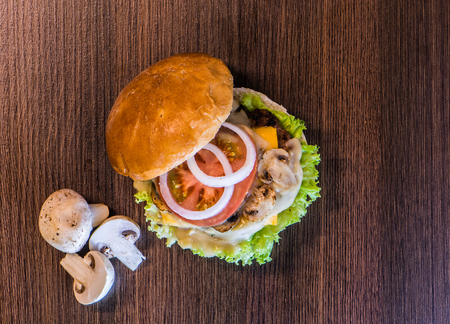 Top view of tasty mushrooms hamburger and all its ingredientsの写真素材