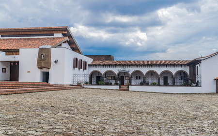 GUATAVITA CUNDINAMARCA, COLOMBIA - DECEMBER 26, 2017: Beautiful colonial architecture of the town's central park.のeditorial素材