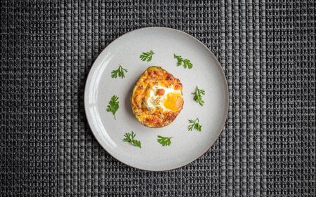 Delicious recipe for the breakfast of avocados stuffed with baked eggの写真素材
