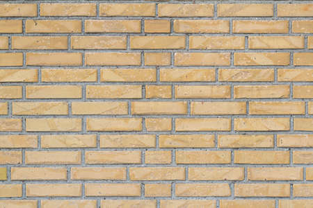Yellow brick wall for texture or background, horizontalの写真素材