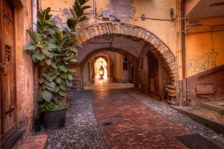 Sanremo, Italy - 05/25/2016 - One of the old scenic narrow streets of historic Sanremo, Italyのeditorial素材