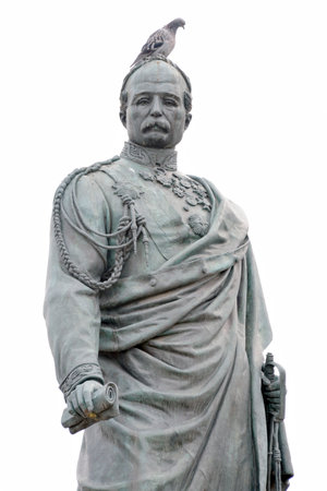 Florence, Italy - September 7, 2021: Pigeon sits on the monument to the hero of the Risorgimento, General Manfredo Fanti in the center of the Piazza San Marco in Florence, Italy. Editorial.のeditorial素材