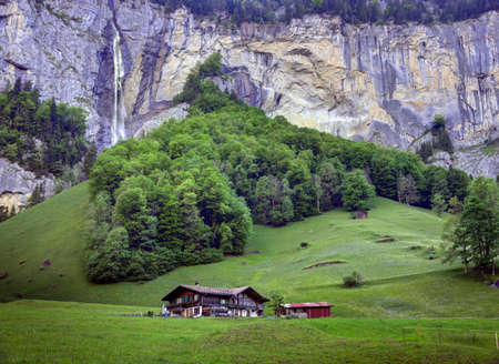 Lauterbrunnen, Switzerland - May 26, 2017: A Swiss farm house in the famous Lauterbrunnen valley in the Swiss Alps Jungfrau Region.のeditorial素材