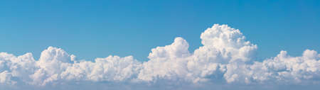 Beautiful panoramic view of white clouds with blue sky as a background. Amazing shape.の写真素材