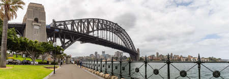 Sydney Harbor, Australia - October 23, 2018: View of Sydney harbor bridge. Cars parked next to it...