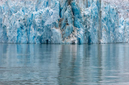 View of a glacier and its reflection in the waterの写真素材