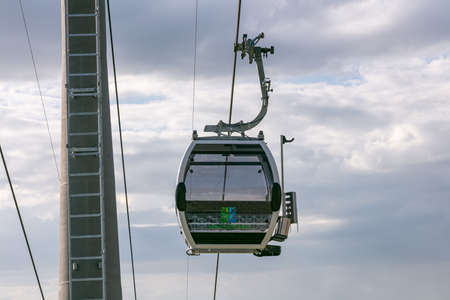Manzherok resort, Altai Mountains, Russia - August 12, 2020: Low angle shot of cableway on a cloudy sky backgroundのeditorial素材