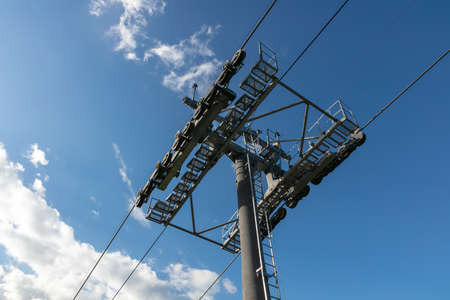Low angle shot of cableway on a blue sky backgroundの写真素材