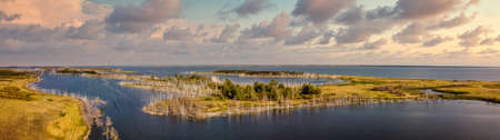 Beautiful panoramic high angle aerial drone shot of islands on one of Gorkoje lakes in Altai Krai,...