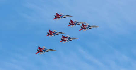 Barnaul, Russia - September 18, 2020: A low angle shot of Strizhi MiG-29 fighter jet squadron...
